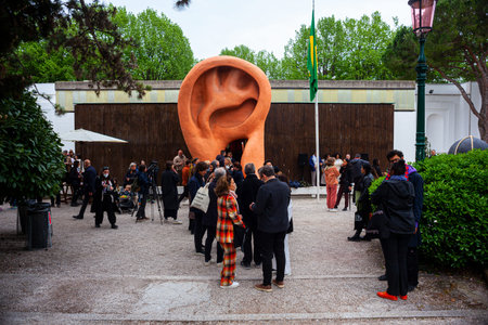 VENICE, ITALY - April 20: Visitors at the Brazilian Pavilion. The title of the project is: With Your Heart in Your Throat by the artist Jonathas de Andrade on April 20, 2022のeditorial素材
