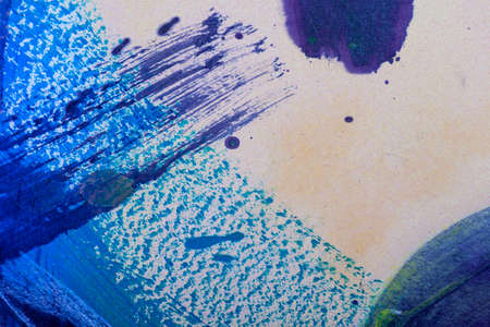Abstract painting is realized with watercolors. The brushes strokes and the dripping technique is made with blue and purple acrylic colorsの写真素材