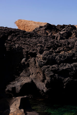 View of the lava rock of Linosa, Sicily. Italy