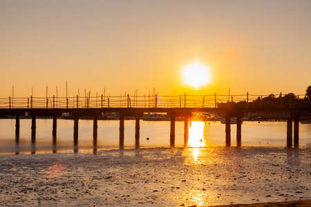High quality photo of a pier at sundown. Wooded bridge seaside with Sunset, Strunjan. Sloveniaの写真素材