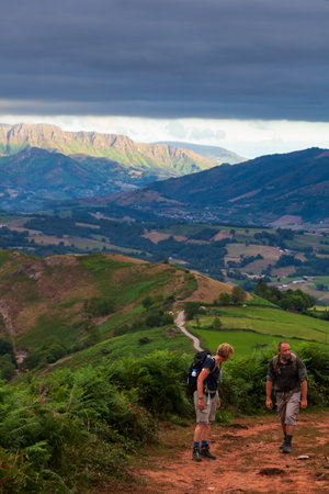 Saint-Jean-Pied-de-Port, France - July 28:, 2022: Couple of Pilgrims along the Camino de Santiago, French Pyreneesのeditorial素材