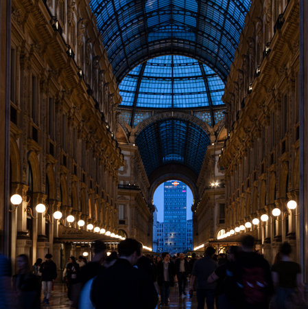 Milan, Italy - October 22, 2022: People walking in the illuminated Galleria Vittorio Emanuele IIのeditorial素材