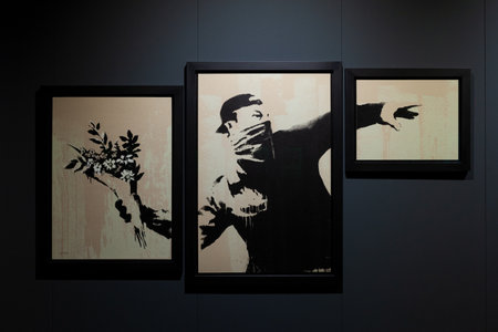 Trieste, Italy - January 21, 2023: Screen print titled Love is in the air - Flower Thrower, Gray version by Banksy. The Great Communicator Banksy, Hall of Enchantments.のeditorial素材