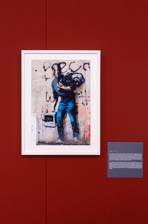 Trieste, Italy - January 21, 2023: Artwork of the series of murals created in the Calais Refugee camp titled London Calling by Banksy. The Great Communicator Banksy, Salone degli Incanti, Triesteのeditorial素材