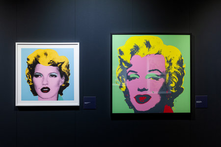 Trieste, Italy - January 21, 2023: Screen prints titled Kate Moss by Banksy and Marilyn by Andy Warhol . The Great Communicator Banksy, Hall of Enchantmentsのeditorial素材