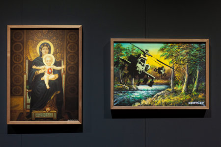 Trieste, Italy - January 21, 2023: Artworks titled Even A Suicide Bomber Needs A Hug and Happy Chopper, by Banksy. The Great Communicator Banksy, Salone degli Incanti of Triesteのeditorial素材