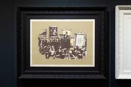 Trieste, Italy - January 21, 2023: Screen print titled Morons Sepia by Banksy. The Great...