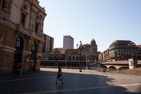 Bilbao, Spain - August 02, 2022: View of the Arriaga theater, Arenal Bridge on the Nervion river and La Concordia Railway Stationのeditorial素材