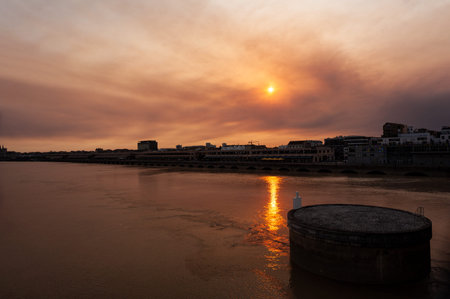 View of the Garonne river and riverside at sunset in Bordeaux