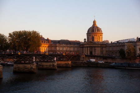 View of the Pont des Arts Artists bridge of Paris with the Institut de France in the backgroundのeditorial素材