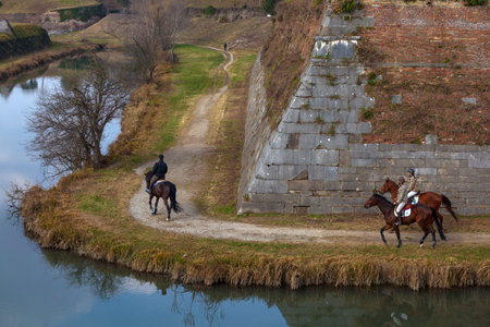 Palmanova, Italy - February 20, 2023: Horseback riders gracefully explore Palmanova's bastions, blending equestrian adventure with the captivating beauty of the surroundingsのeditorial素材