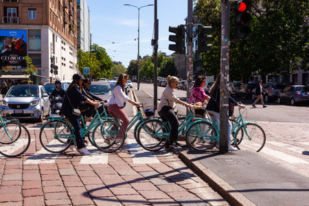 Milan Italy - April 26, 2023: Rent bikes. A large group of cyclists in Garibaldi district
