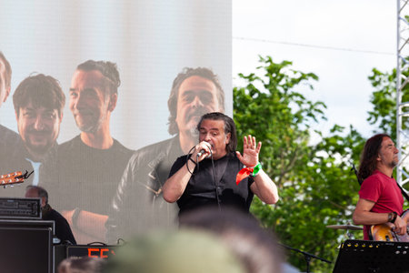 Gattatico, Reggio Emilia, Italy - April 25, 2023: The singer Cisco, pseudonym of Stefano Bellotti in concert with the folk-rock band BandabardÃ² during the Liberation Day at the 25 April concertのeditorial素材