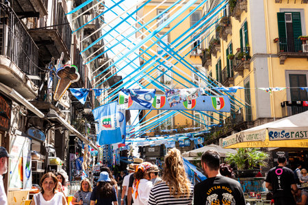 Naples, Italy - June 16, 2023: Naples champions of Italy, Blue and white celebration ribbons and flags on the street of Spaccanapoli in the city center of Naplesのeditorial素材