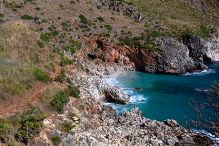 Paradise empty beach and turquoise sea named "Cala Capreria" at the Zingaro Nature Reserve in Italian called Riserva dello Zingaro, Scopello, Sicily, Mediterranean Sea, Italyの写真素材