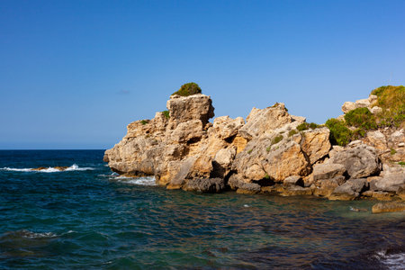 Paradise sea bay with azure water and beach view from coastline trail of Zingaro Nature Reserve Park, between San Vito lo Capo and Scopello, Trapani province, Sicily, Italy.の写真素材