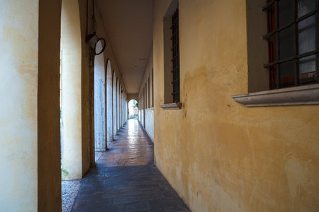 Perspective of covered passageway along a street in Treviso, Italyの写真素材