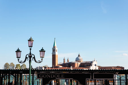 Jetty leading to the waters of Venice harbor with the San Giorgio Monastery in the background, Venice, Italyの写真素材