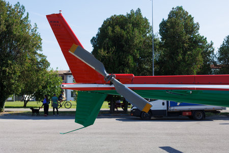 The gray tail rotor of a red and green helicopter. Propeller on tail of a red multi-purpose twin-engine helicopter.の写真素材