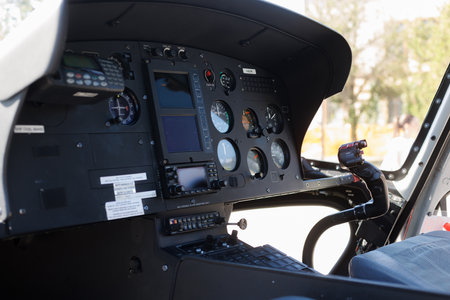 Joystick to control the helicopter. Flight deck with flight control elements and multifunctional displays in an I-ULYA helicopterの写真素材