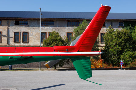 The tail of an Italian red and green helicopter. Propeller on tail of a red multi-purpose twin-engine helicopter.の写真素材