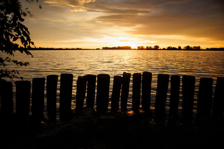 Cloudy sunset over Mincio river in Mantua, Italy