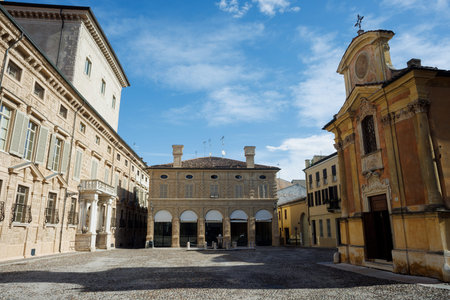 Piazza Matilde di Canossa in Mantua, featuring the historic church and palace, with a charming view...
