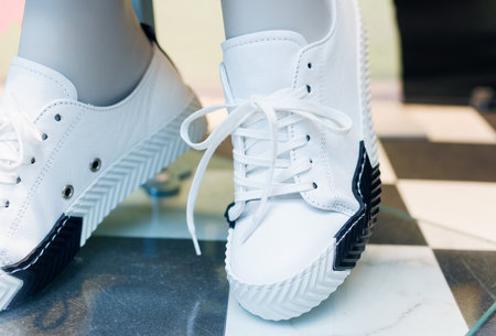Close up of Mannequins wear white sneakersの写真素材