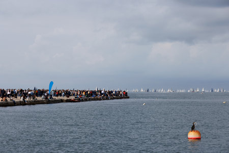 Trieste, Italy - October 09, 2024: People looking at the sailboats during the 56th Barcolana regattaの写真素材