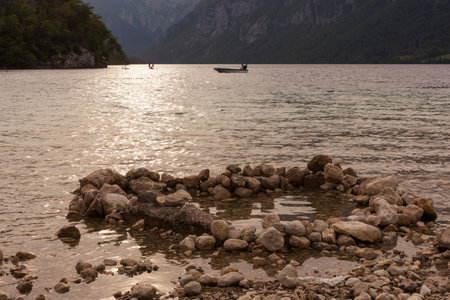 Heart of stones in water, view over Lake Bohinj, Triglav National Park, Sloveniaの写真素材
