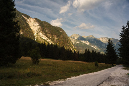 Crepuscular rays, commonly known as sunbeams, sun rays, or god rays over the Julian Alps in Sloveniaの写真素材