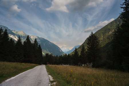 Crepuscular rays, commonly known as sunbeams, sun rays, or god rays over the Julian Alps in Sloveniaの写真素材