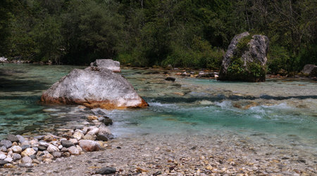 Boulders and stones in the river bed of the Soca river, Bovec, Slovenia, Europeの写真素材