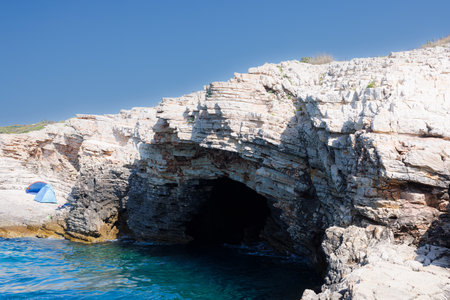 View of the sea cave Kamenjak National Park on the Premantura peninsula in Medulin municipality, Istria, Croatia in the summer seasonの写真素材