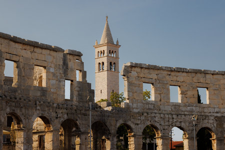 View of Catholic Church next to the Roman Amphitheater, Pula, Istria County, Croatia, Adriatic, Europeの写真素材