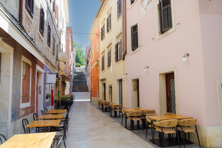 View of the sunny colorful street of ancient Pula town, Croatiaの写真素材
