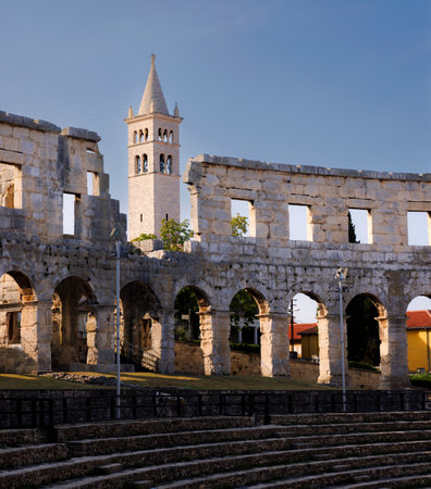 View of Catholic Church next to the Roman Amphitheater, Pula, Istria County, Croatia, Adriatic, Europeの写真素材