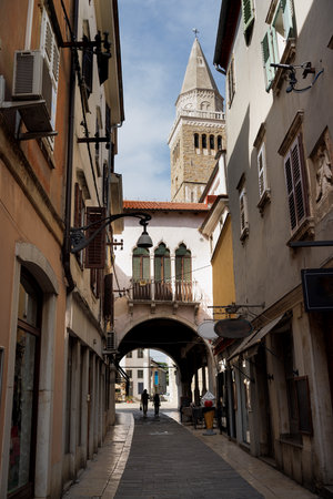 Streets of the old town of Koper with the Cathedral of the Assumption bell tower in the background, Istrian region of southwest Sloveniaの写真素材