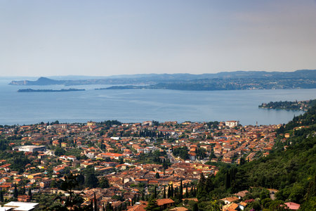 Top View of Lake Garda and the town below from the Church of San Michele Arcangelo in Gaino, Toscolano-Maderno. Italyの写真素材
