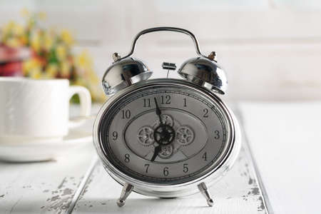 Start up concept.Coffe cup,alarm clock. Morning coffee day start.の写真素材