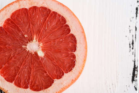 Pink Grapefruit isolated on white wooden backgroundの写真素材