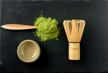 Set for Japanese green tea matcha on a black stone background.の写真素材