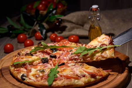 Delicious fresh pizza served on wooden tableの写真素材
