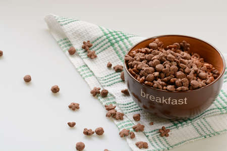 Cereal chocolate balls in bowl. Light backgroundの写真素材