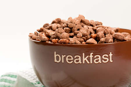 Cereal chocolate balls in bowl. Light backgroundの写真素材