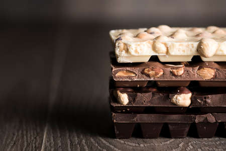 Chocolate . Chocolate bar on dark wooden backgroundの写真素材