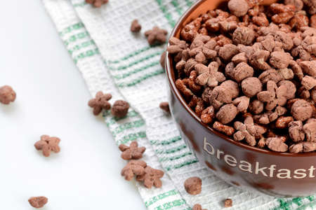 Cereal chocolate balls in bowl. Light backgroundの写真素材