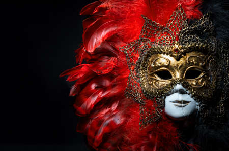 Italian carnival venetian mask on black background. Mysterious event, partyの写真素材