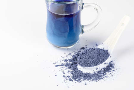 Blue matcha tea powder on a white background. Eastern strengthening tea for health and weight loss.の写真素材