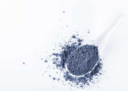 Blue matcha tea powder on a white background. Eastern strengthening tea for health and weight loss.の写真素材